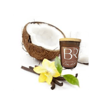 a candle with a coconut and vanilla